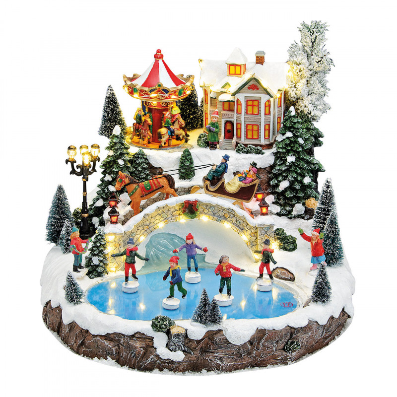 Winterdorf mit beweglichen Schlittschuhläufern und Karussell